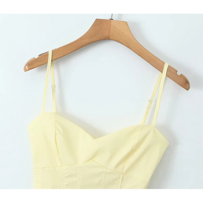 allvariant::spaghetti strap top on a wooden hanger against a white background