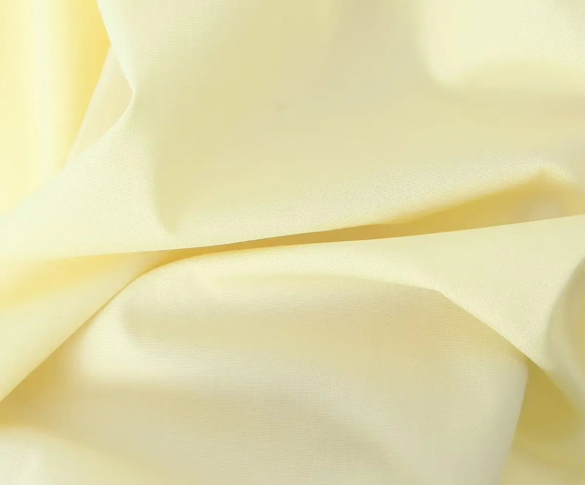 allvariant::Close-up of light yellow fabric with folds