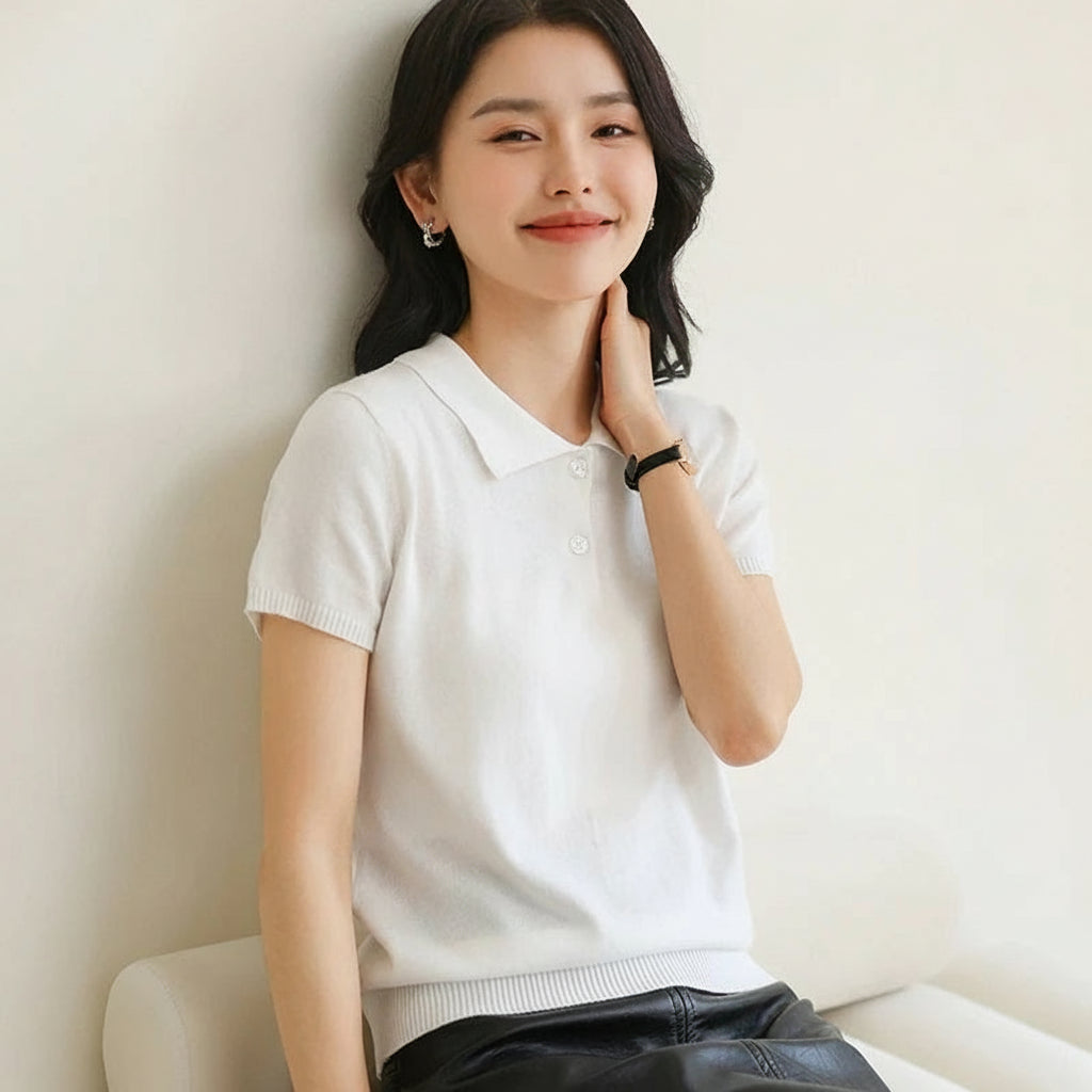 White:: Woman wearing a white short-sleeve shirt against a plain background with 'YTFidio' branding.