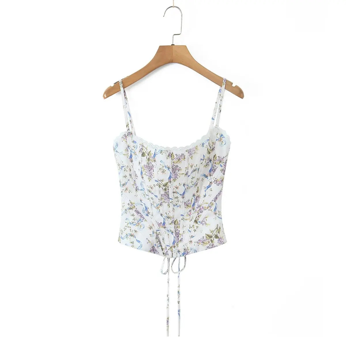 white::Floral print top on a wooden hanger against a white background