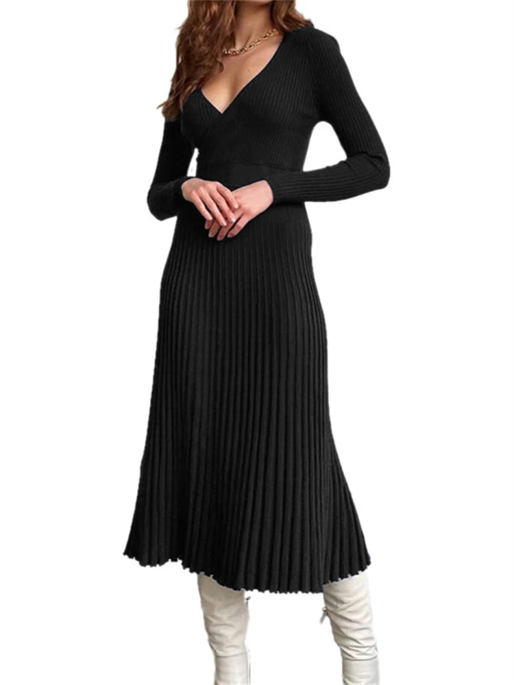 allvariants:: Black pleated dress worn by a person on a white background