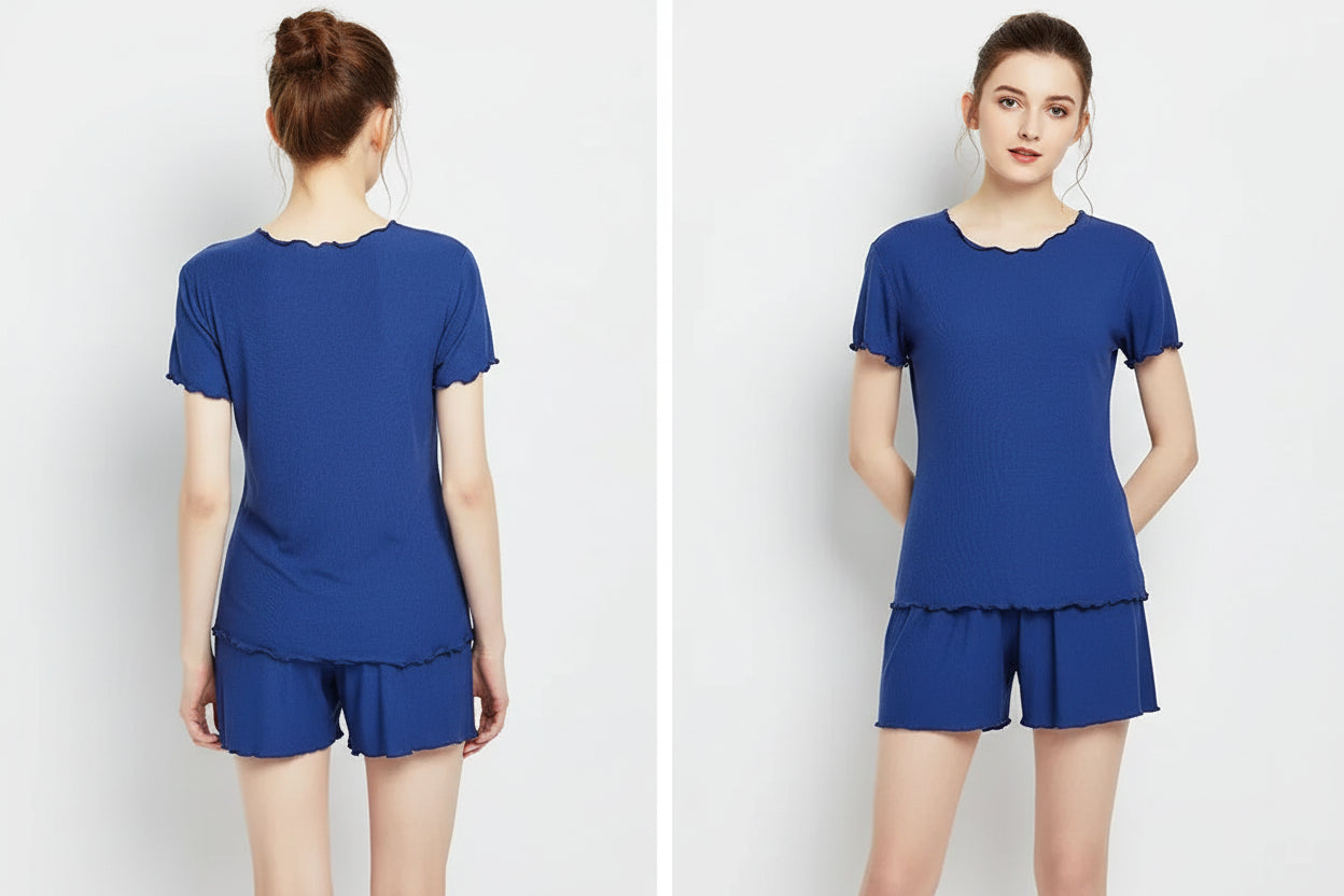 allvariants:: Woman wearing a blue pajama set on a white background with 'Space Blue' text.