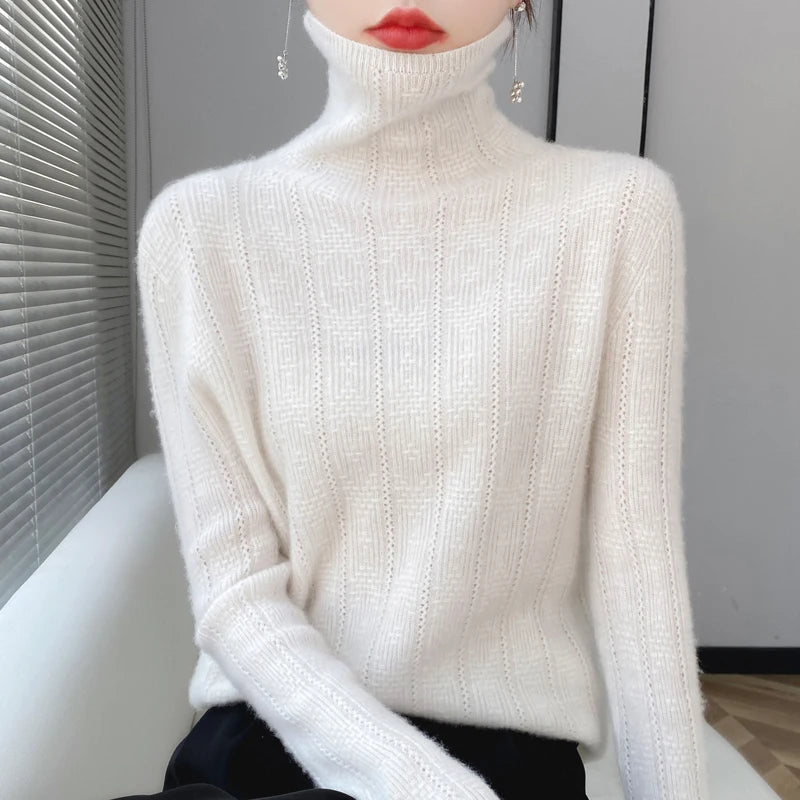 allvariants:: Person wearing a white turtleneck sweater sitting on a white couch.