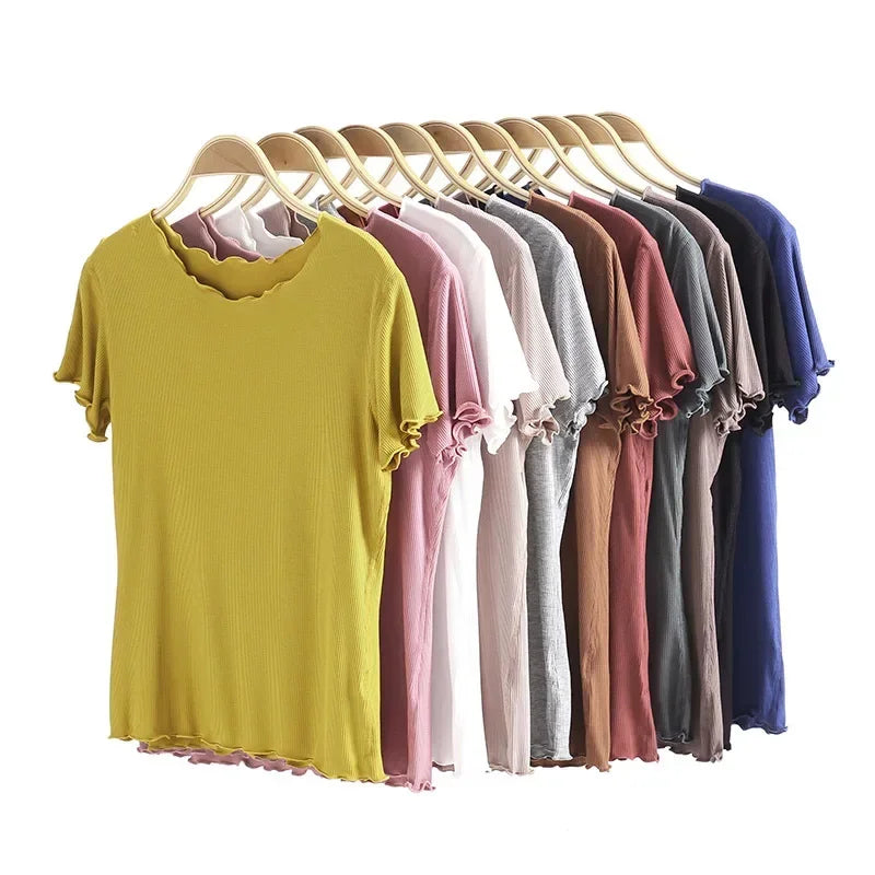 allvariants:: Row of colorful t-shirts on hangers against a white background