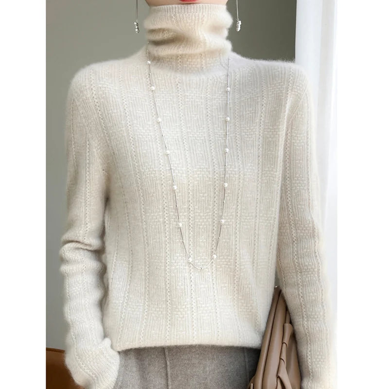 allvariants:: Person wearing a beige turtleneck sweater with pearl details.