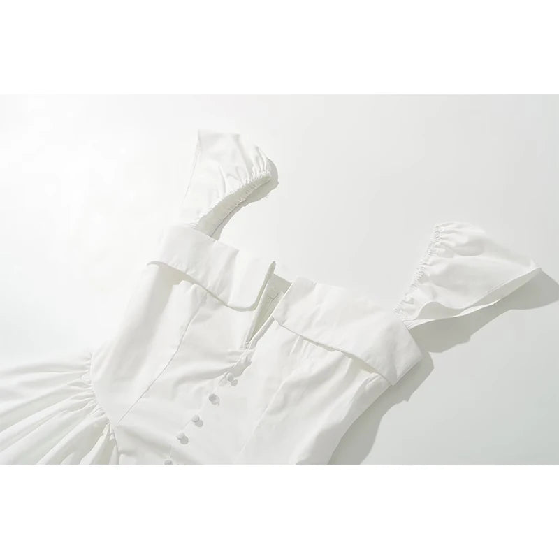 white::White dress with ruffled details on a white background