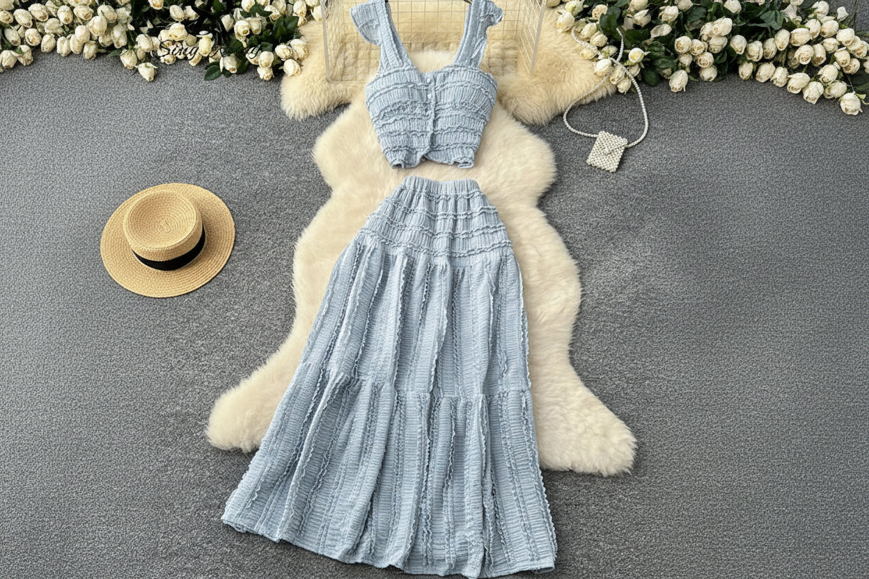 allvariants:: Light blue textured dress on a hanger with decorative elements