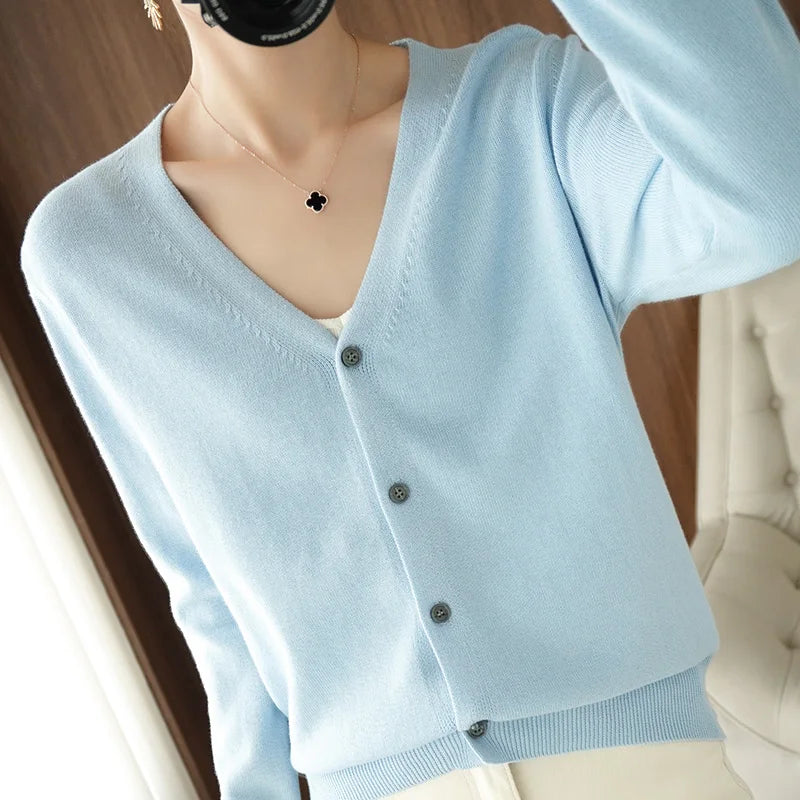 allvariants:: Light blue cardigan worn by a mannequin with a blurred background