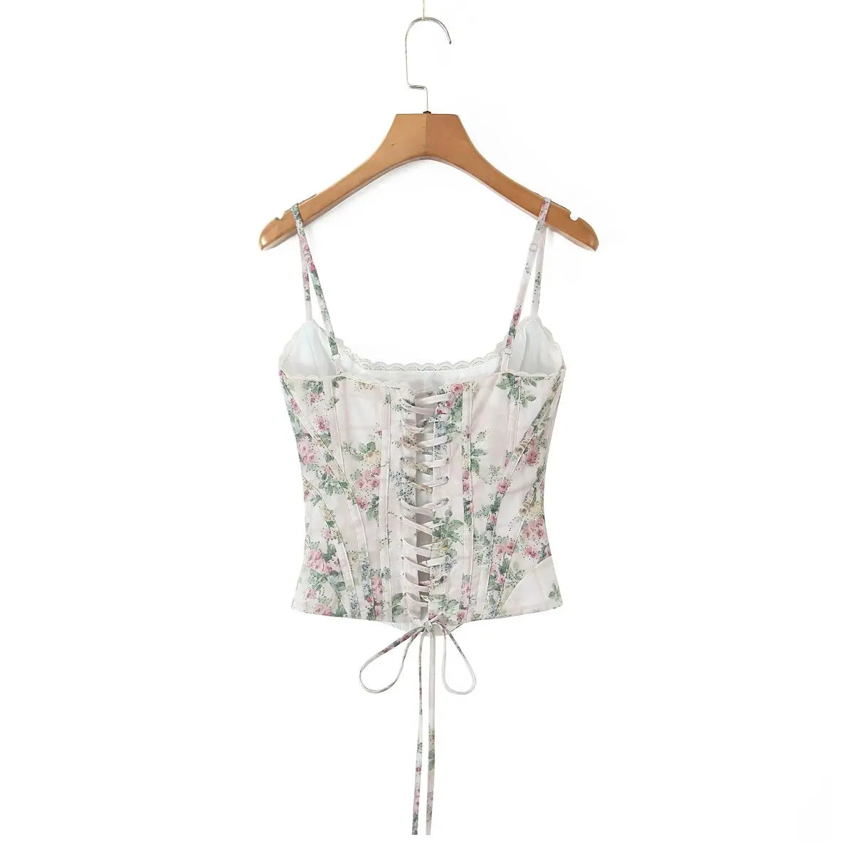 cream::Floral print top on a wooden hanger against a white background