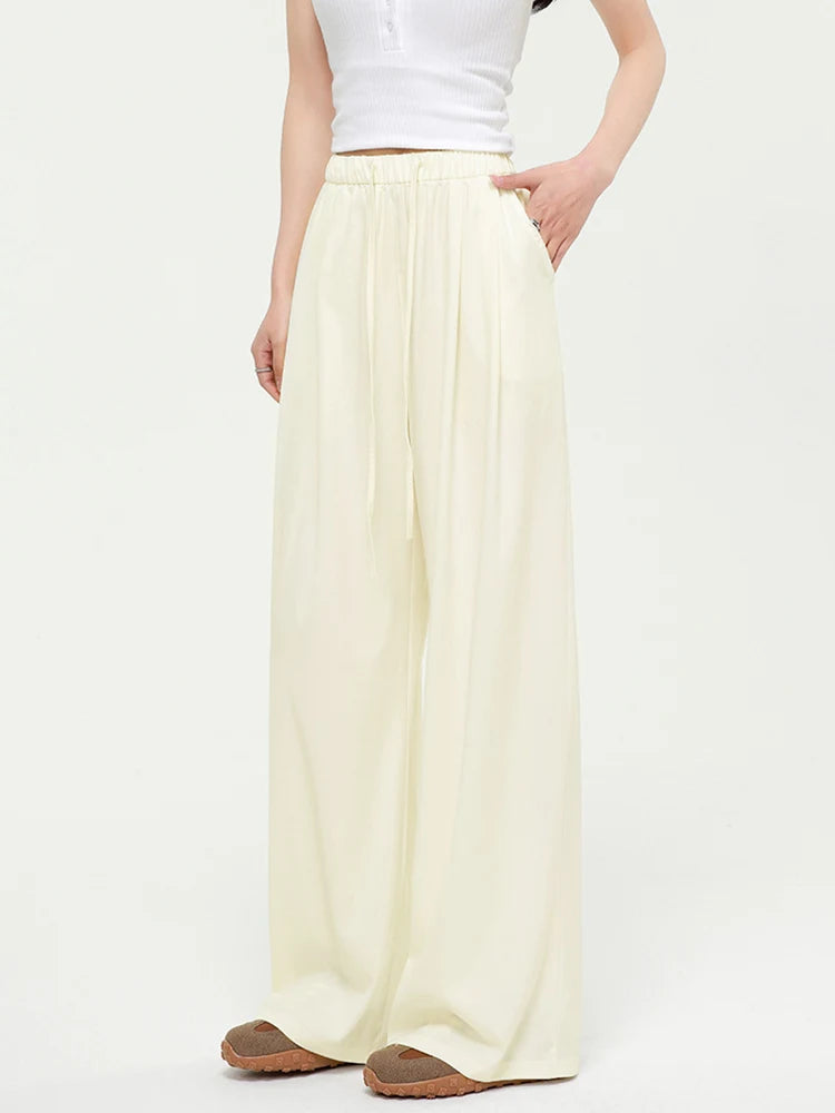 allvariants:: Person wearing a long light yellow skirt on a white background