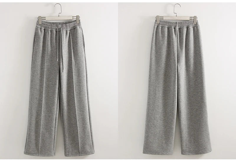 allvariants:: Gray sweatpants on hangers against a white background