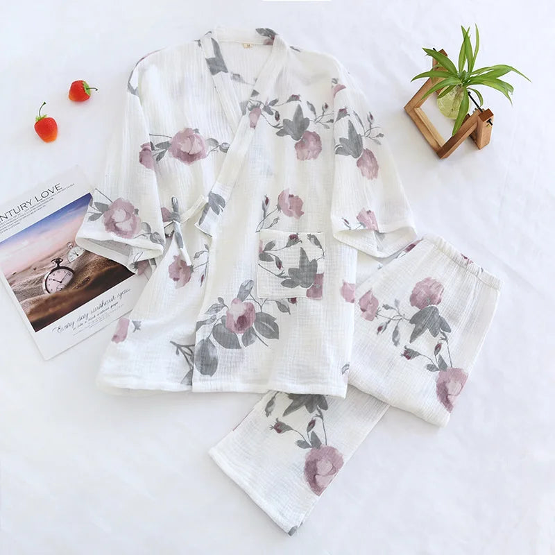 allvariants:: Floral pajama set on a white surface with a magazine and small plant.
