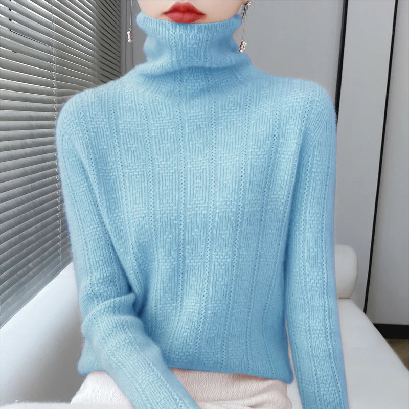 allvariants:: Light blue turtleneck sweater worn by a person sitting on a white couch.