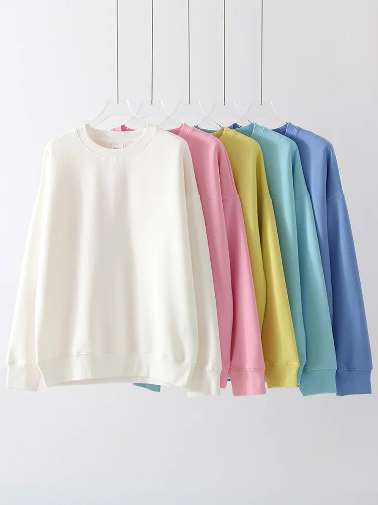 allvariants:: Set of pastel-colored sweatshirts on a white background