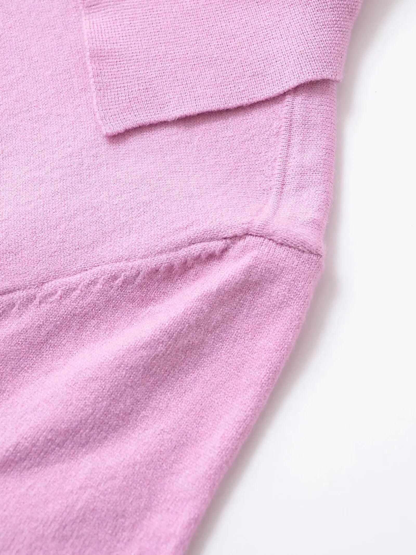 pink::Close-up of a pink fabric texture on a white background