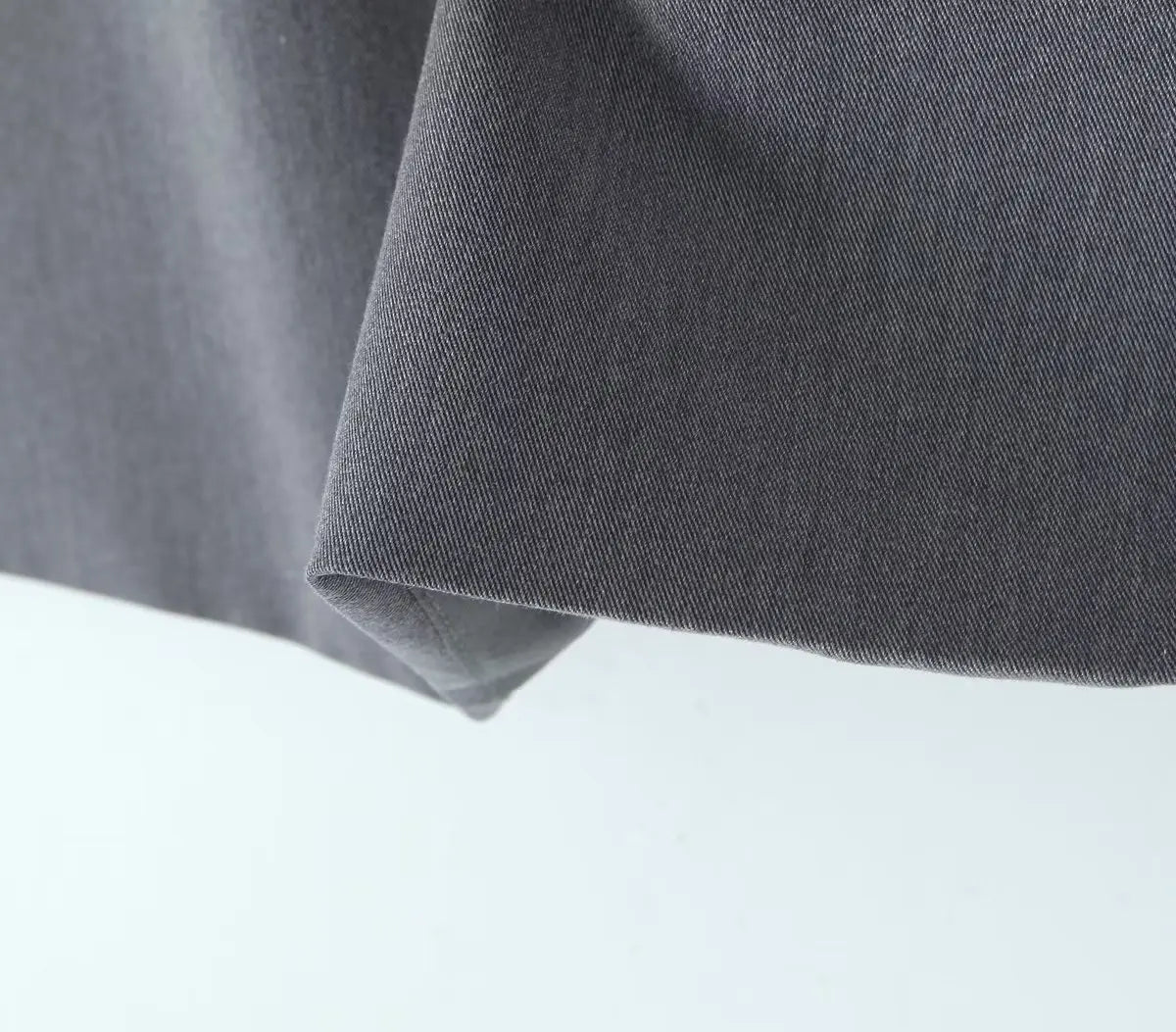 gray::Close-up of gray fabric on a light gray background