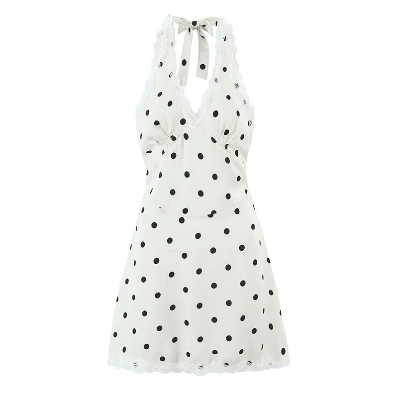 White dress with black polka dots on a white background