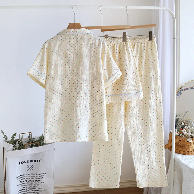 01:: Floral pajama set hanging on a rack with a white background