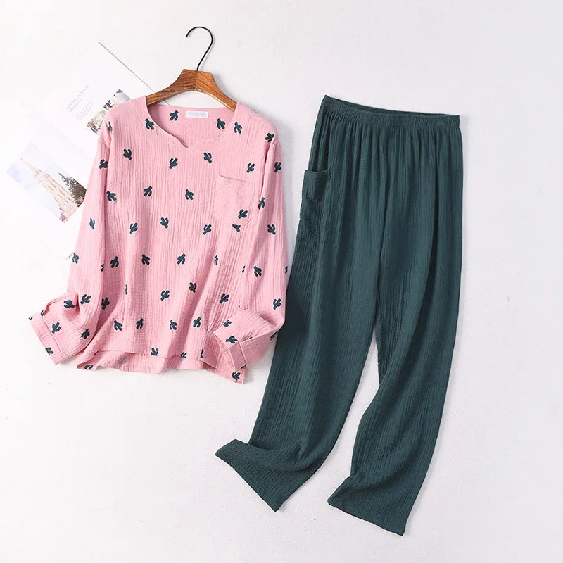 allvariants:: Pink floral blouse and green pants on a white background