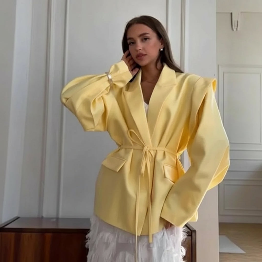 allvariants:: Woman wearing a yellow coat in an indoor setting