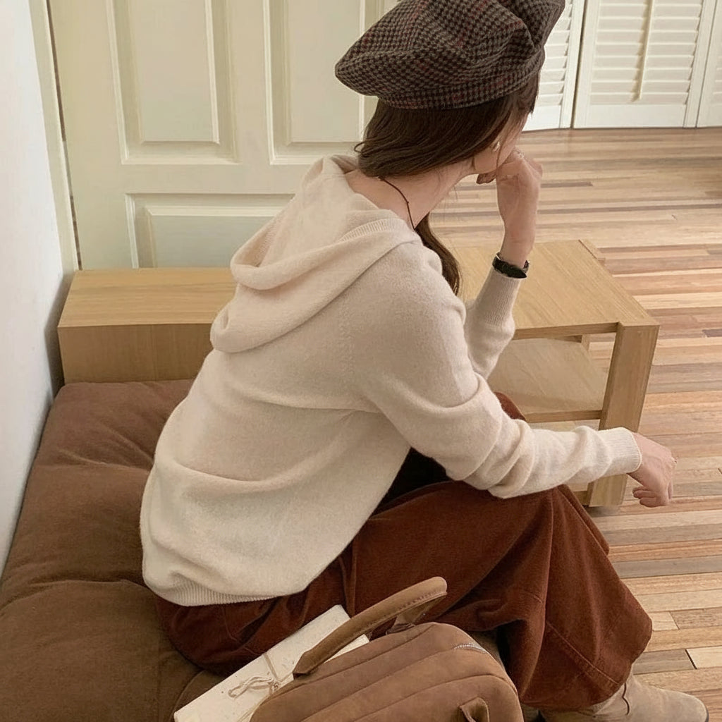 Beige:: Person sitting on a couch wearing a beige hoodie and brown pants, with 'YTFidio' branding.