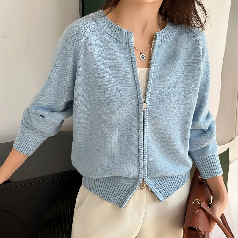 allvariants:: Light blue zip-up cardigan worn by a person, with a neutral background