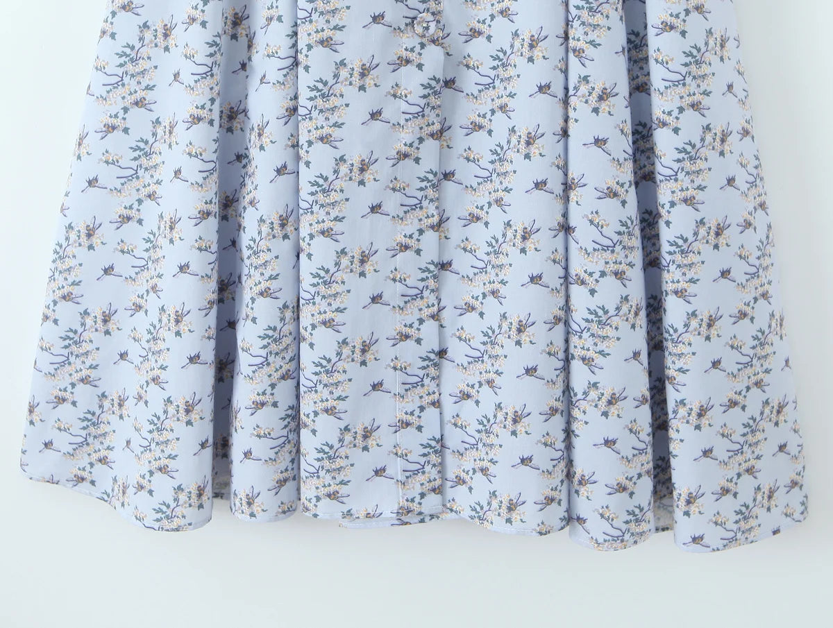 light blue::Floral patterned curtain on a white background