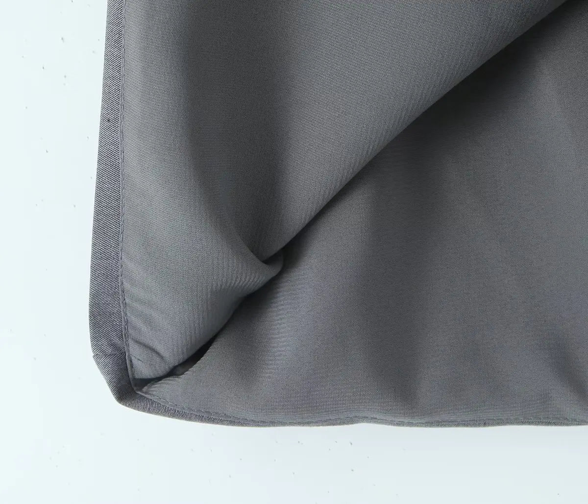 gray::Close-up of gray fabric on a white background