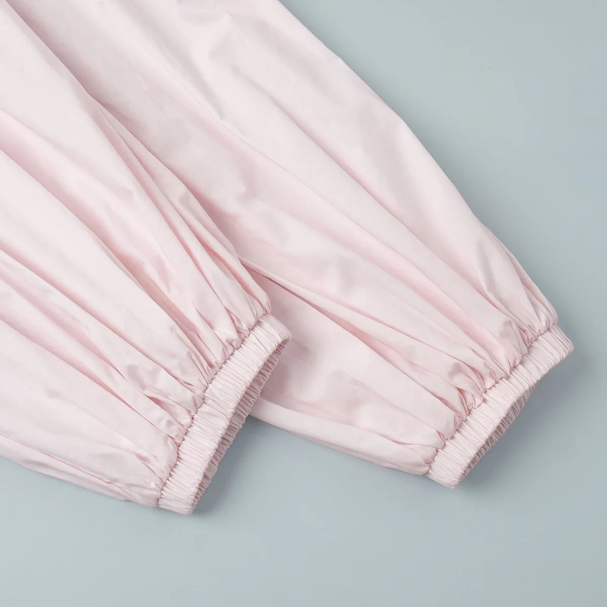 pink::Light pink pants on a light blue background