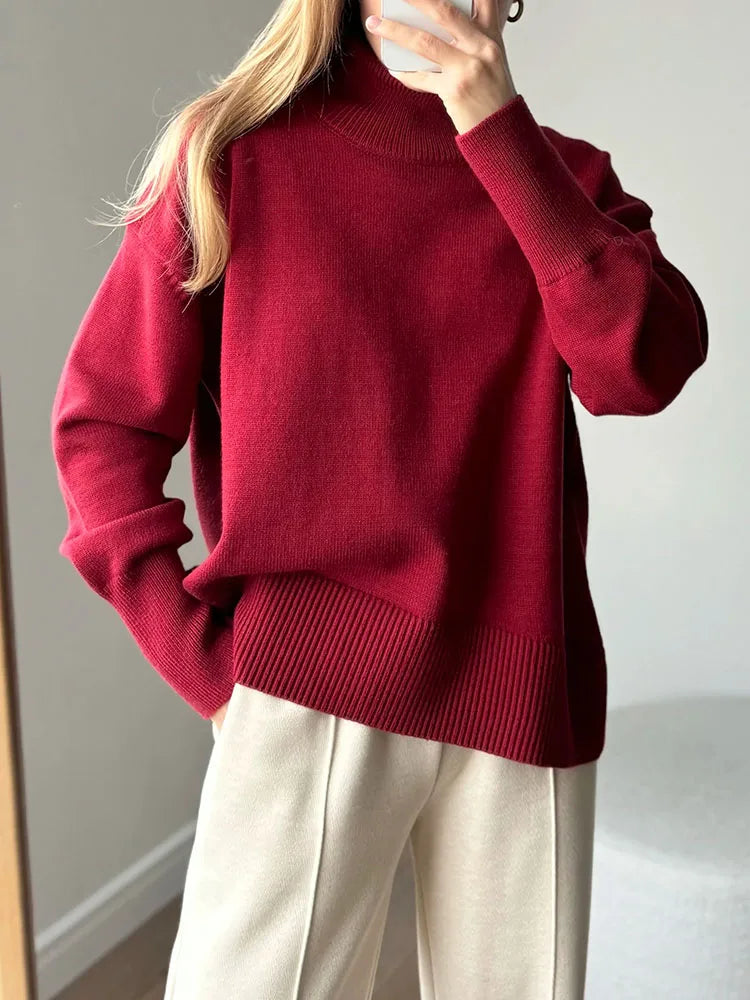 allvariants:: Person wearing a red sweater and white pants against a neutral background