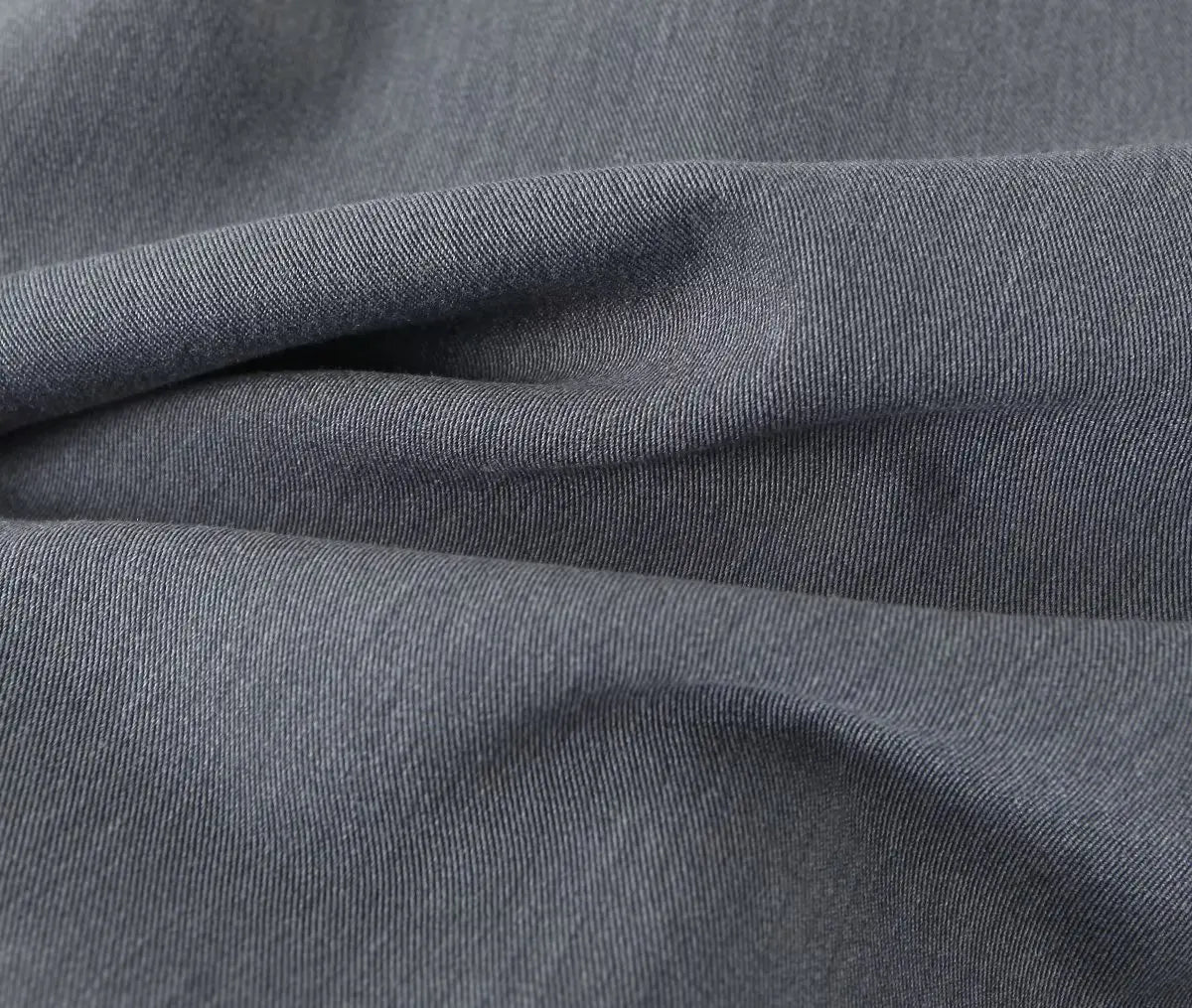 gray::Close-up of gray fabric with visible texture