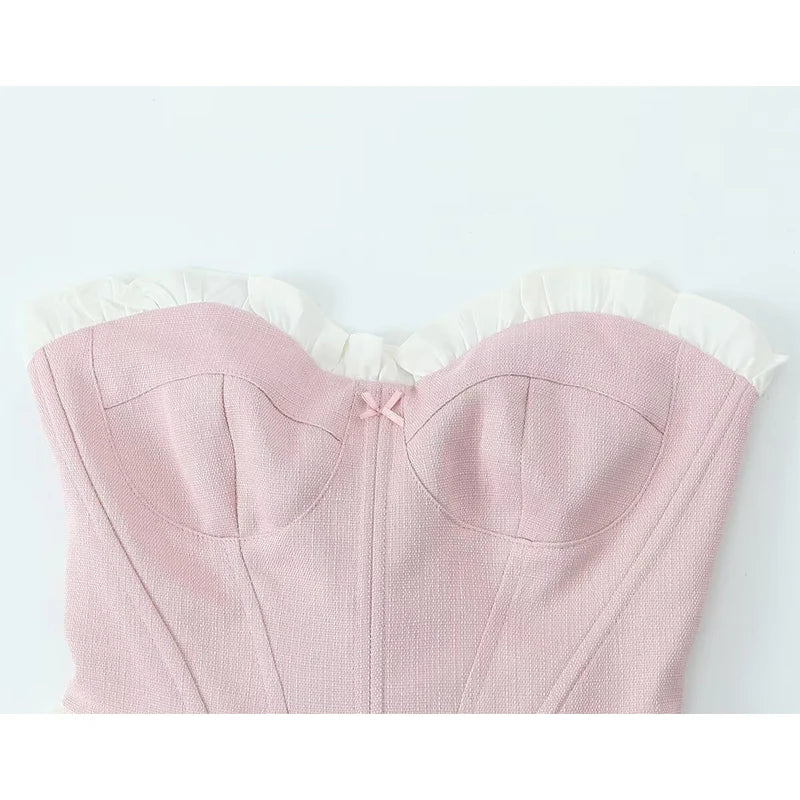 pink::Pink top with white trim on a light gray background