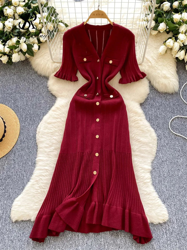 allvariants:: Red dress with buttons on a white fur rug