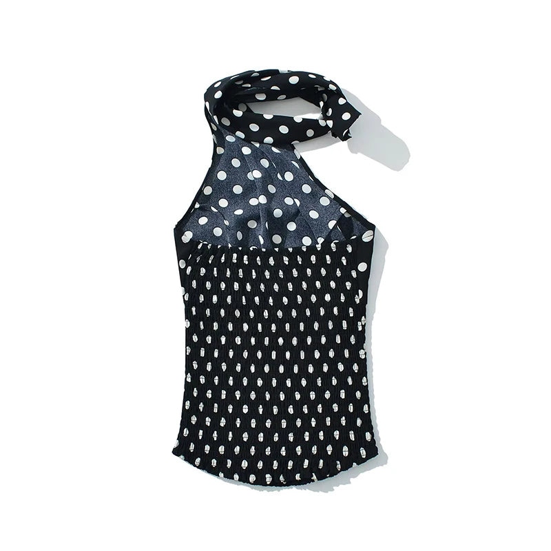 black::Black sleeveless top with white polka dots on a white background