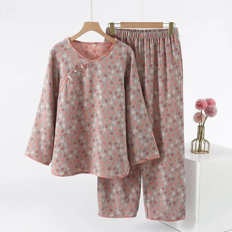 allvariants:: Floral pajama set on hangers with a vase of flowers on a white background