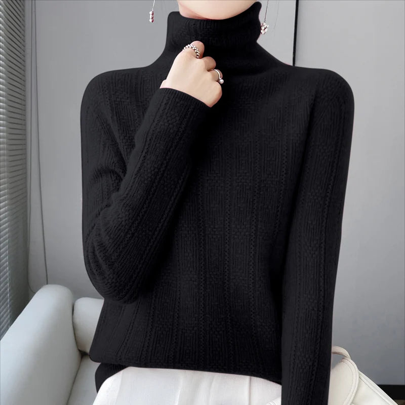 allvariants:: Person wearing a black turtleneck sweater sitting on a white chair.