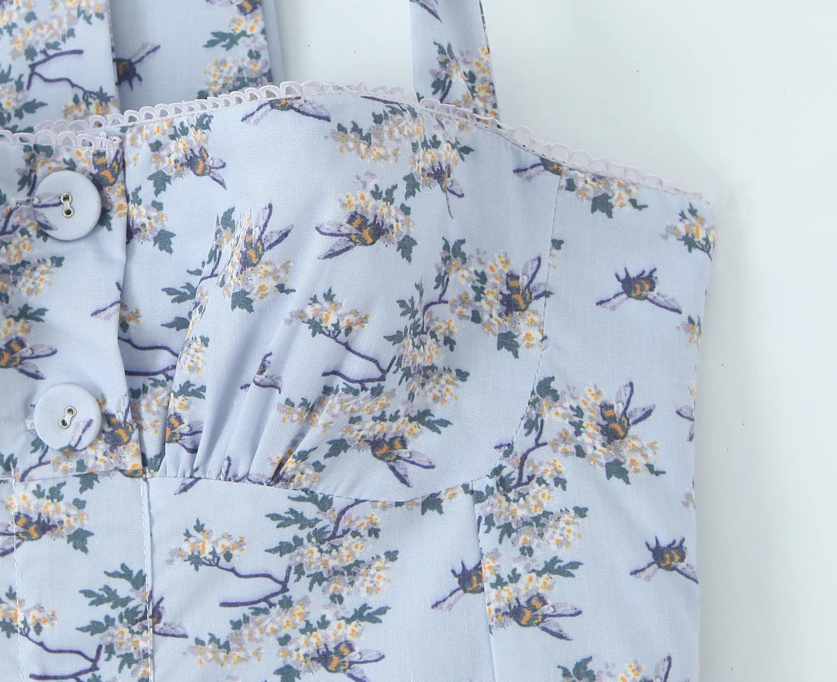 light blue::Floral patterned fabric with buttons on a white background