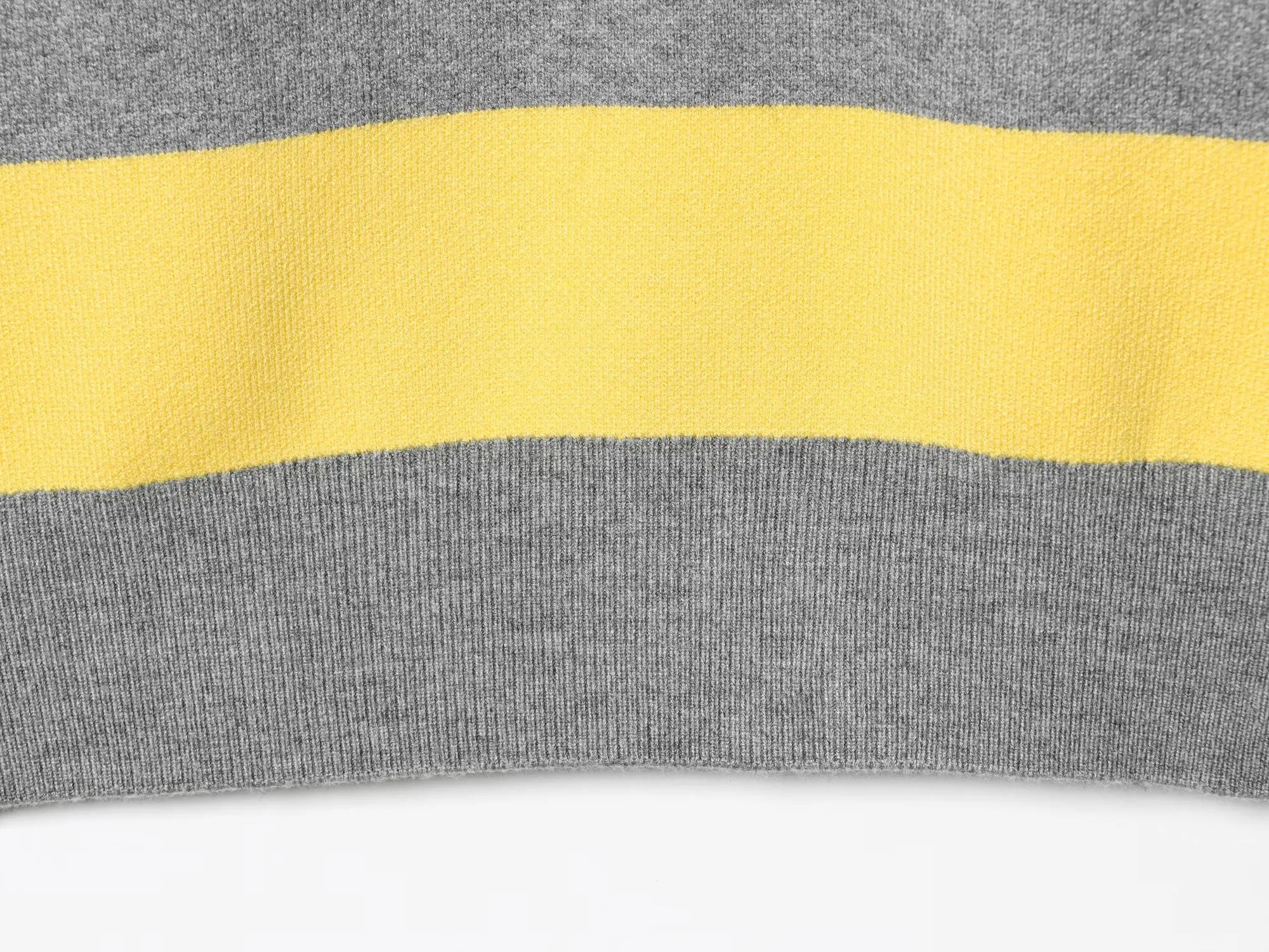 stripped::Close-up of a gray and yellow striped fabric on a white background