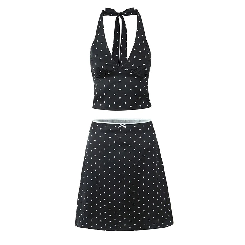 black::Black polka dot top and skirt set on a white background