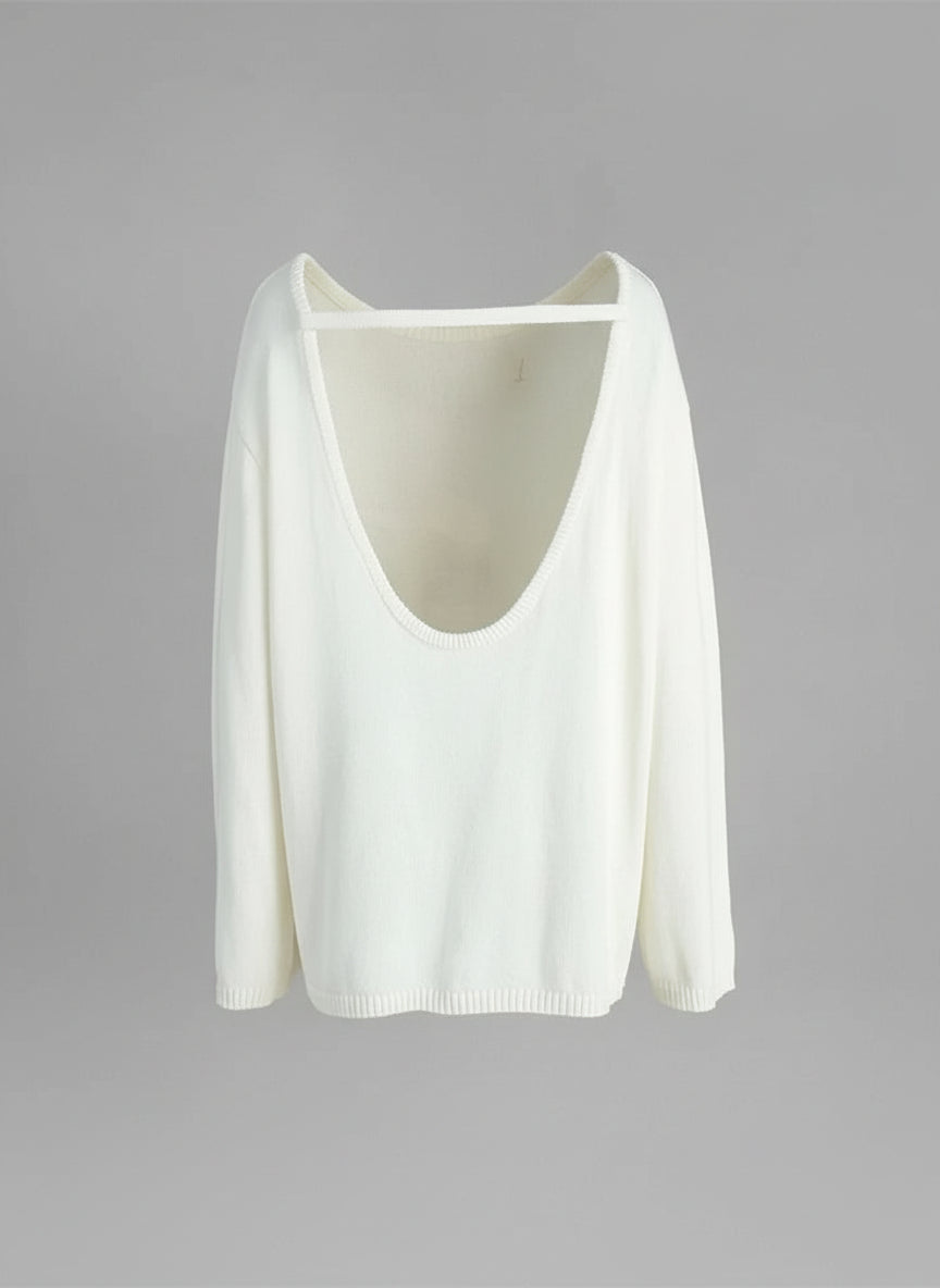 white:: White sweater with a deep neckline on a mannequin against a gray background