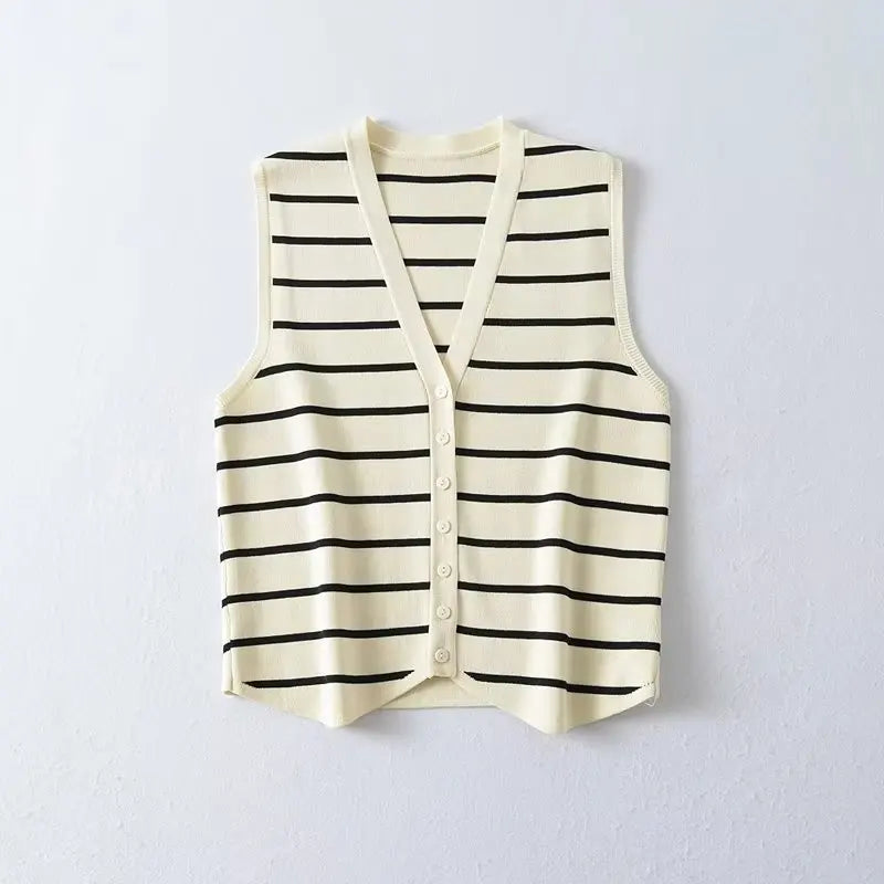Striped::Striped vest with black and white stripes on a light gray background