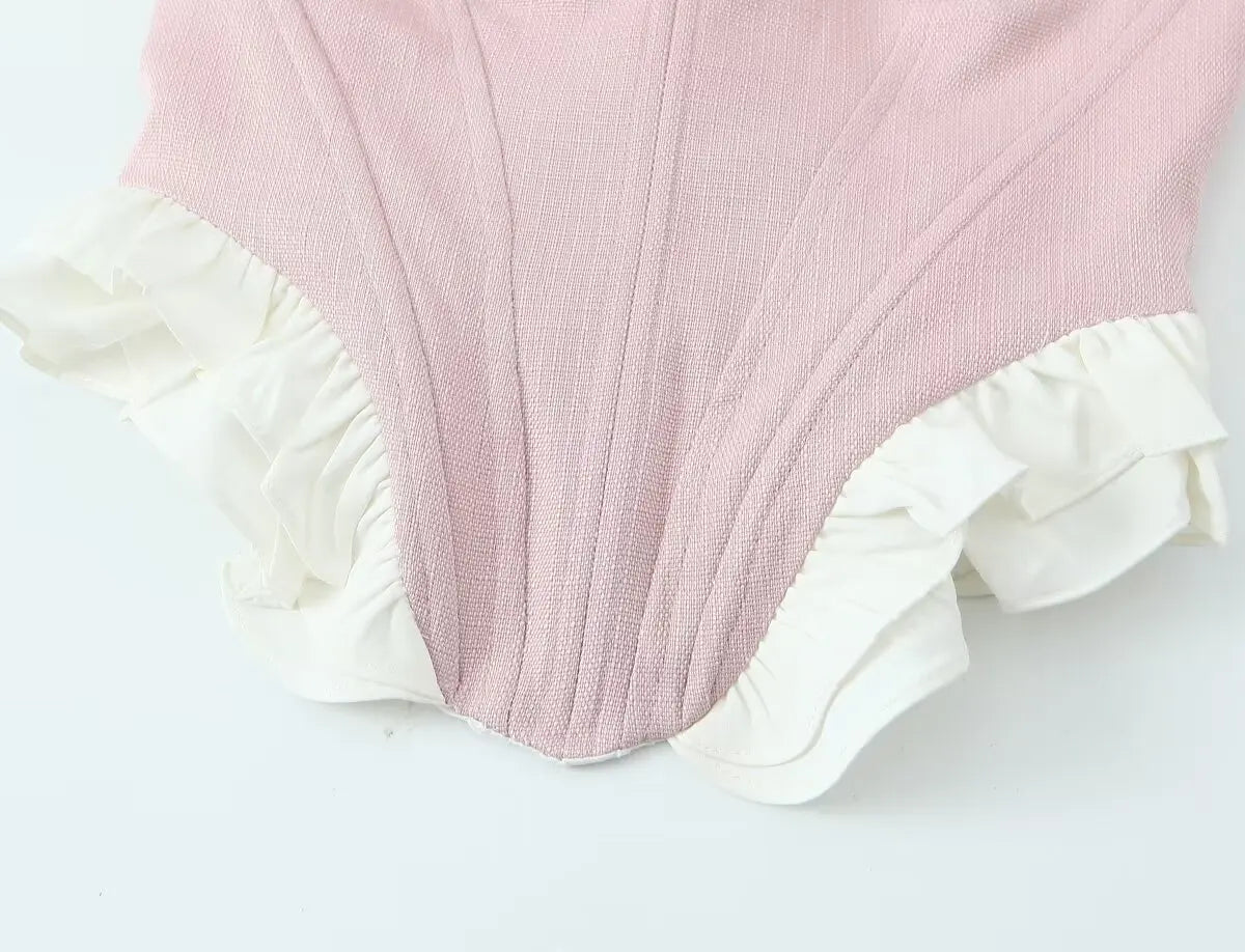 pink::Pink fabric with white ruffle on a light gray background