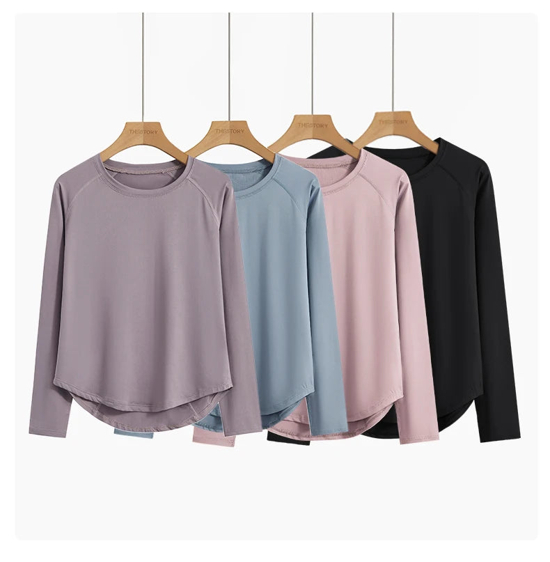 allvariants:: Four long-sleeve shirts in different colors hanging on wooden hangers against a white background.