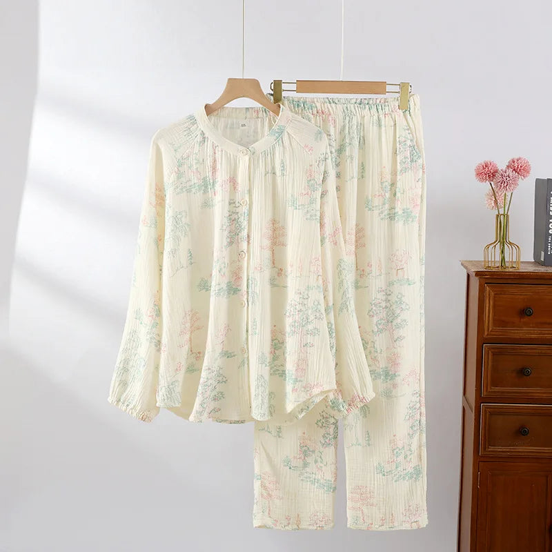 allvariants:: Floral pajama set hanging on a hanger against a white wall with a wooden dresser in the background.
