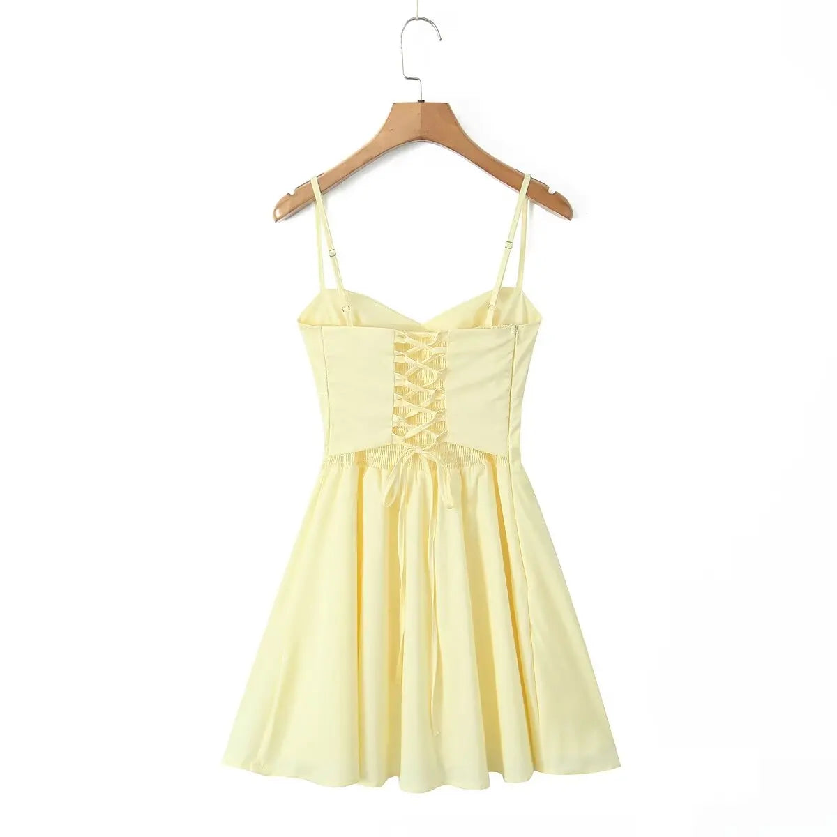 allvariant::Yellow dress on a wooden hanger against a white background