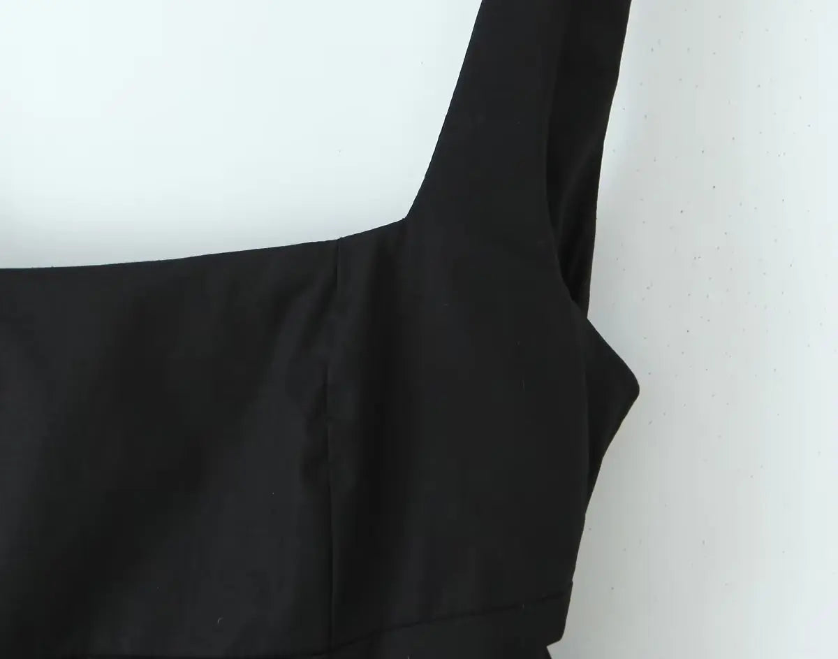 Black::Black fabric draped over a white surface