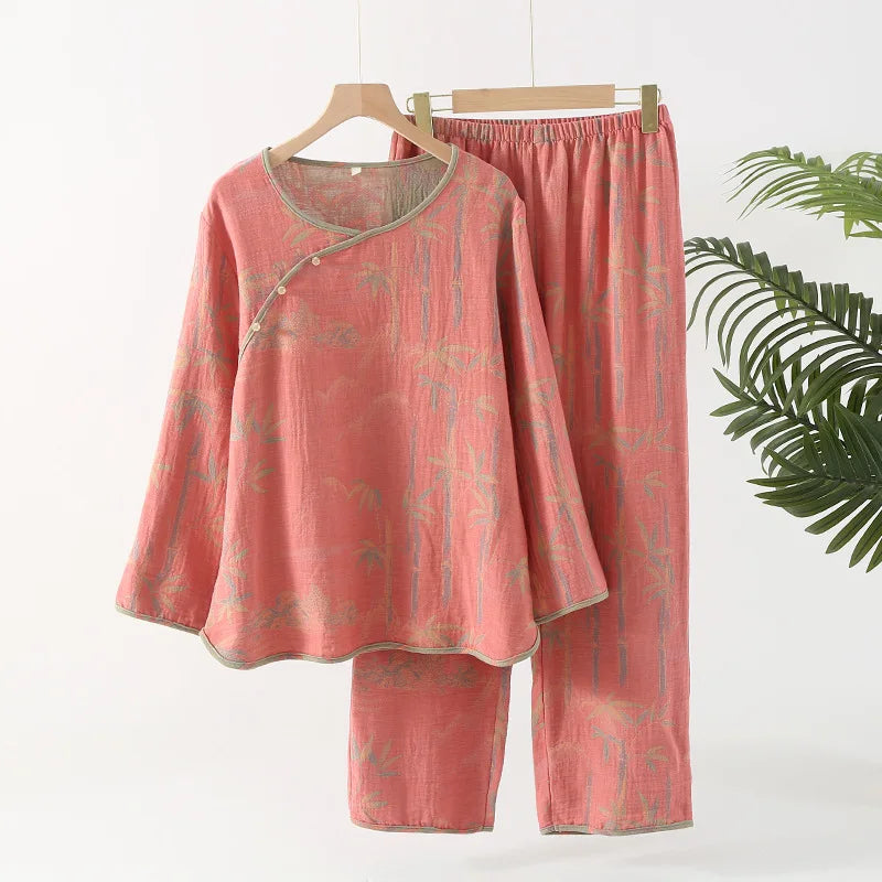 allvariants:: Coral pajama set with floral pattern on a hanger against a white background