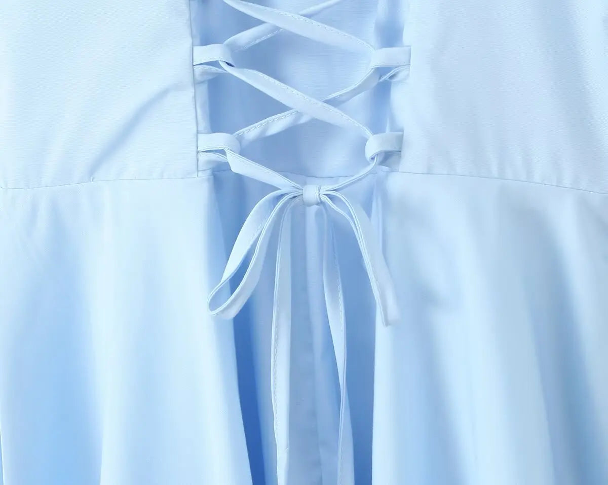 allvariant::Light blue dress with lace-up front detail on a light blue background