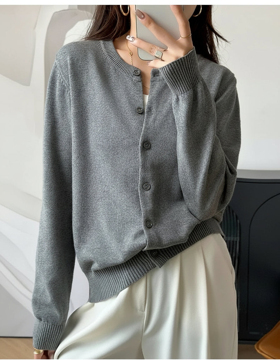 Grey:: Person wearing a gray cardigan with text 'INTELLECTUAL' on a blurred background