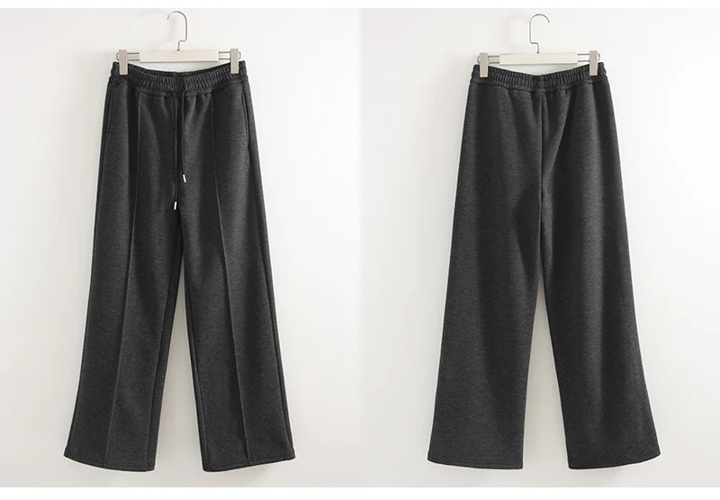 allvariants:: Black wide-leg pants on hangers against a white background
